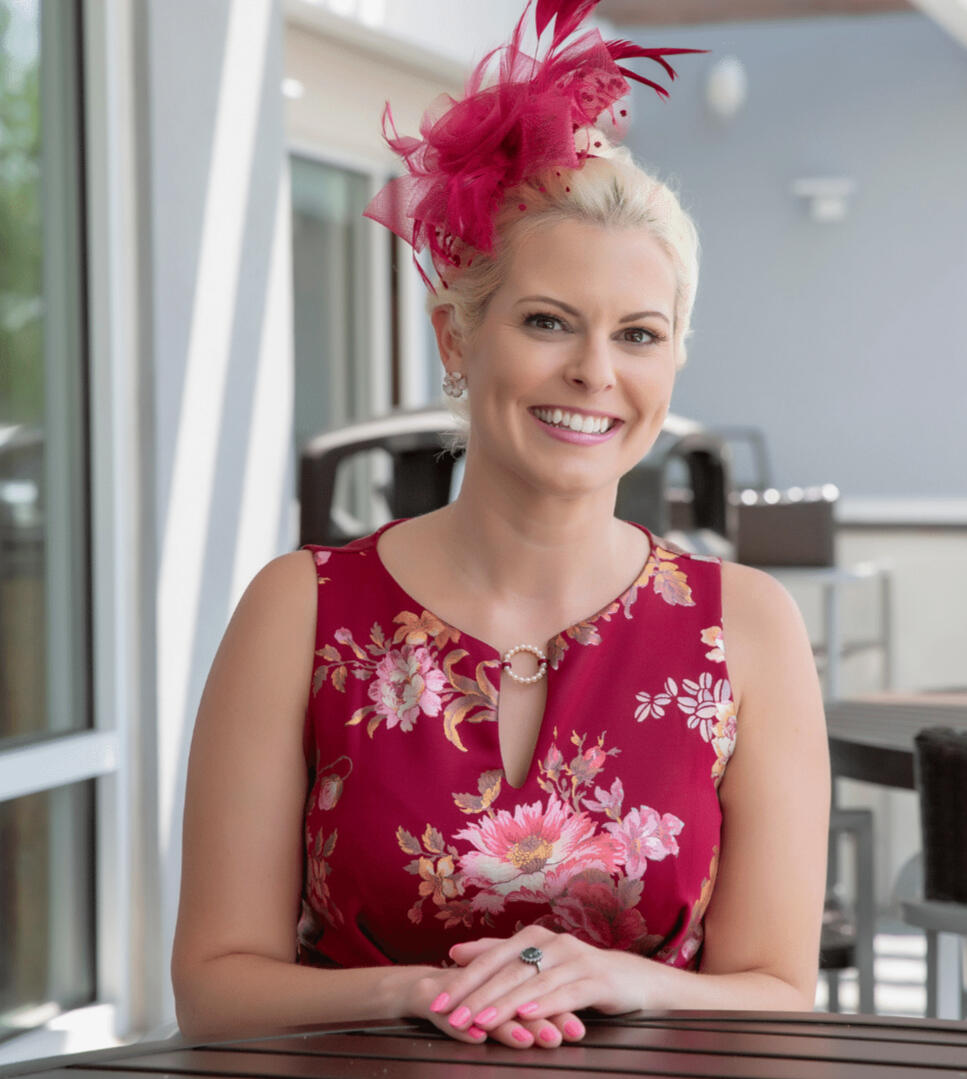Headshot of Lady Amy Lady Amy wearing a Red dress and red fascinator